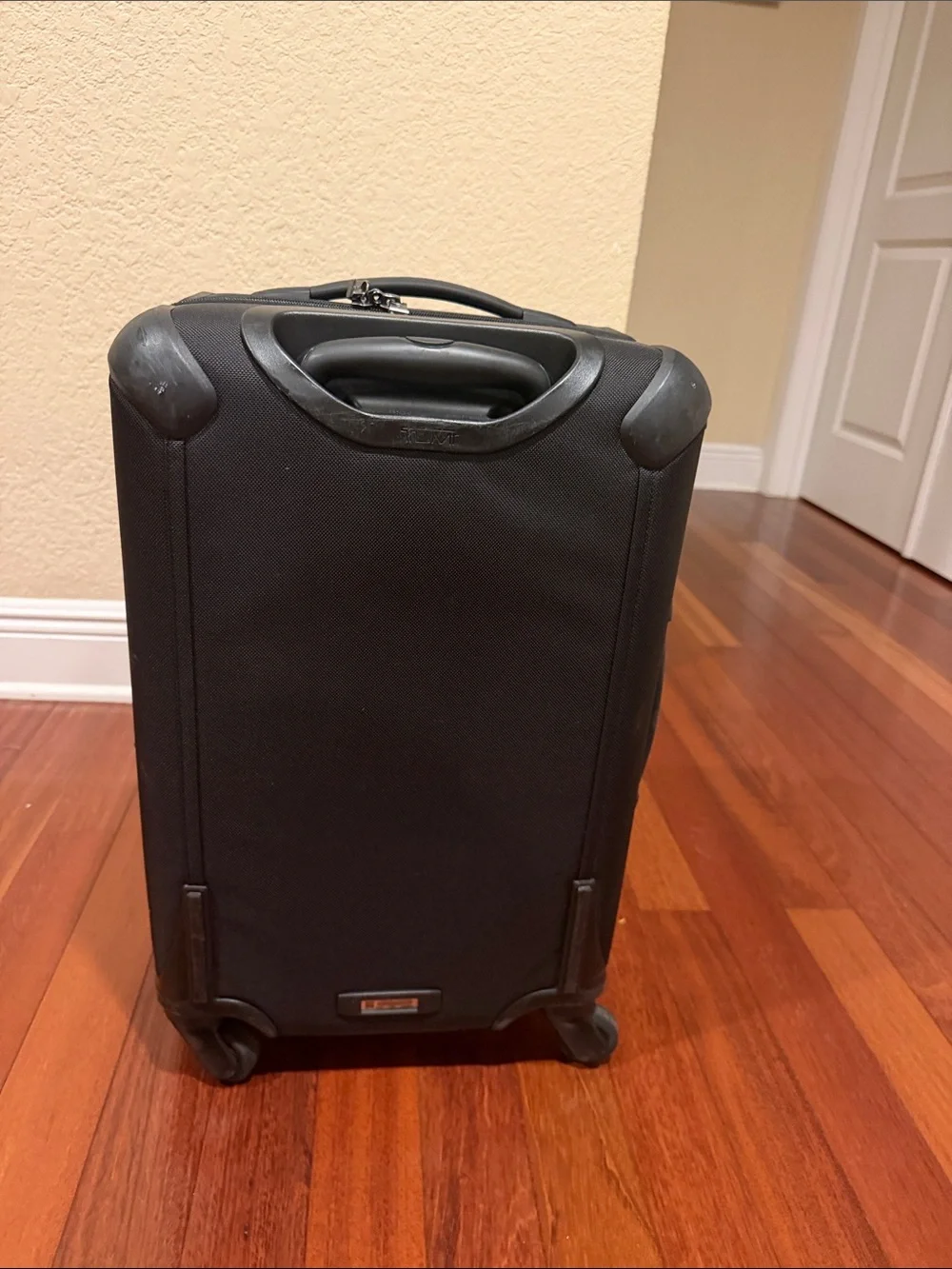 Tumi Black Carry-On Spinner with Front Zip Pocket